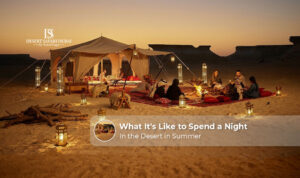 Couple enjoying an overnight desert camping experience in Dubai during a summer evening.